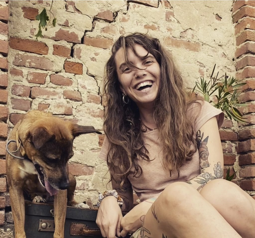 Andrea laughing with her dog